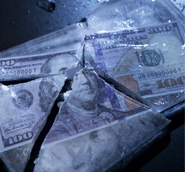 Release Frozen Fund photo shows a 100 dollar bill frozen, Total Apps solves your payment processing issues.